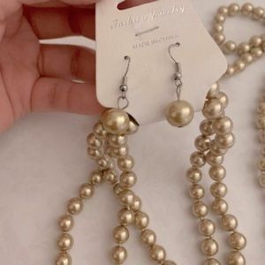Golden pearl earring and necklace set
